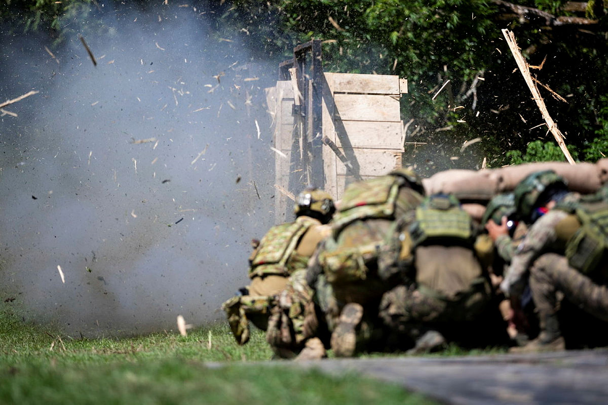 Daylight breach charge detonation